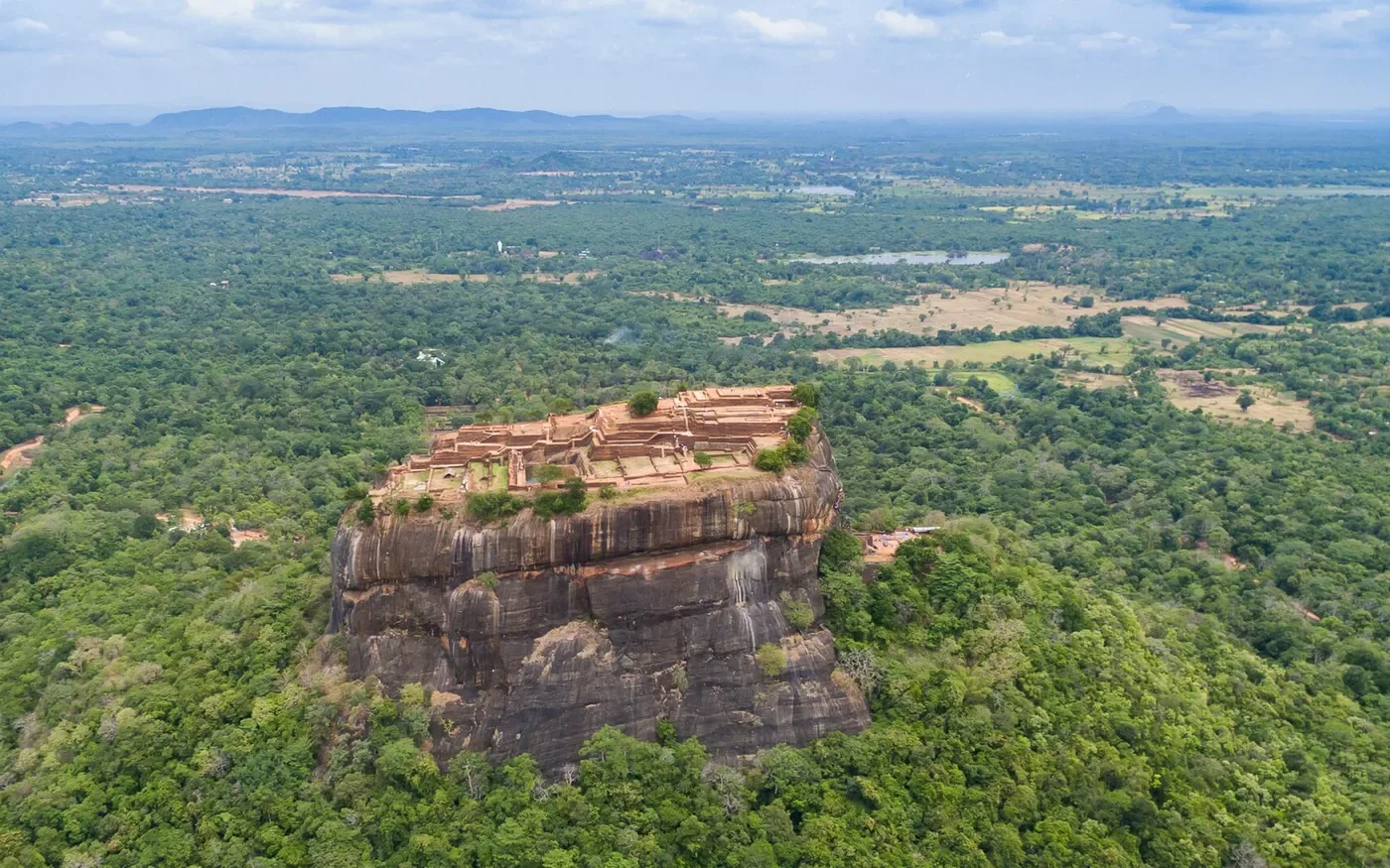 Aerial view of Sigiriya Rock above forest and ancient gardens