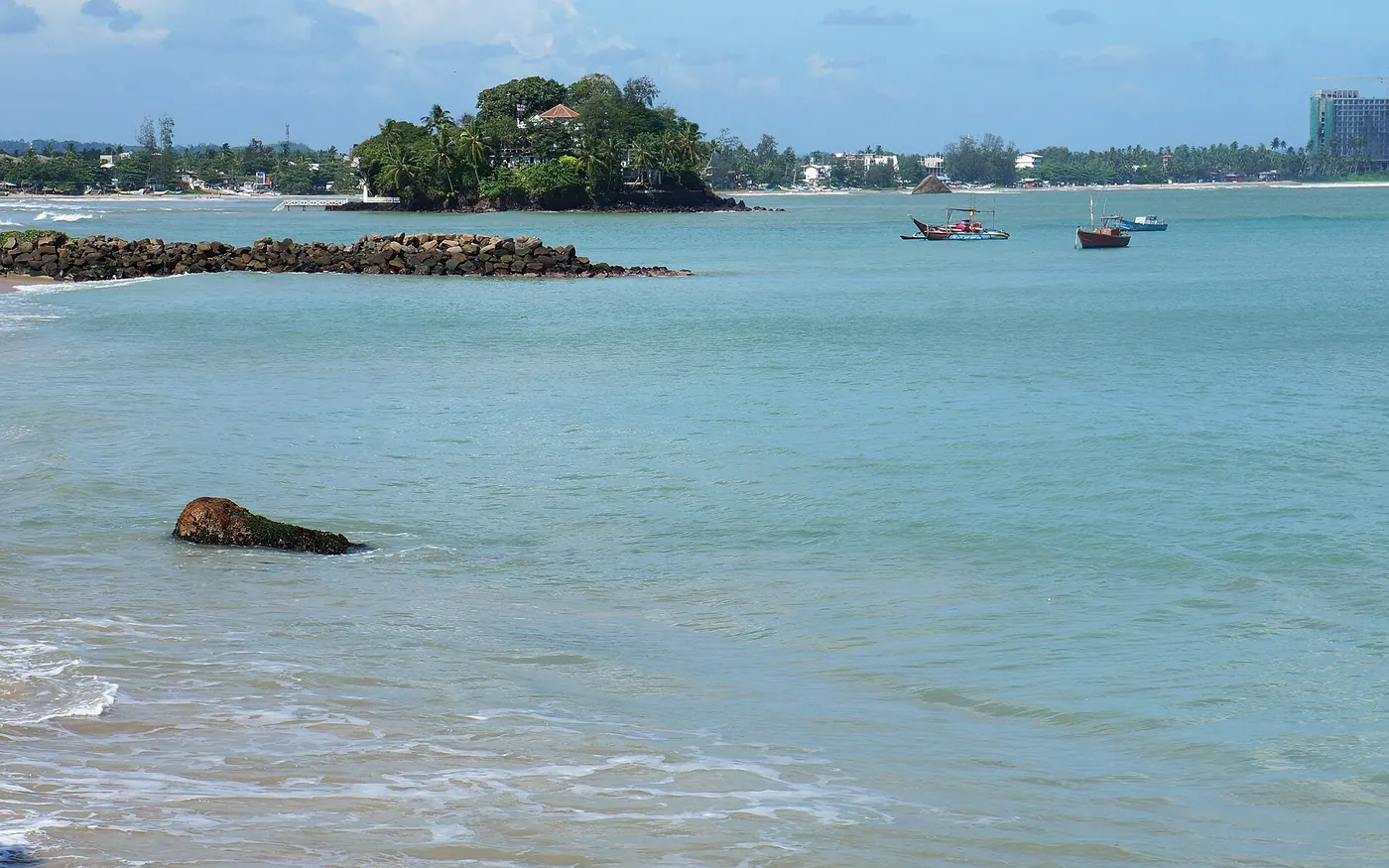 Weligama bay with boats and shoreline