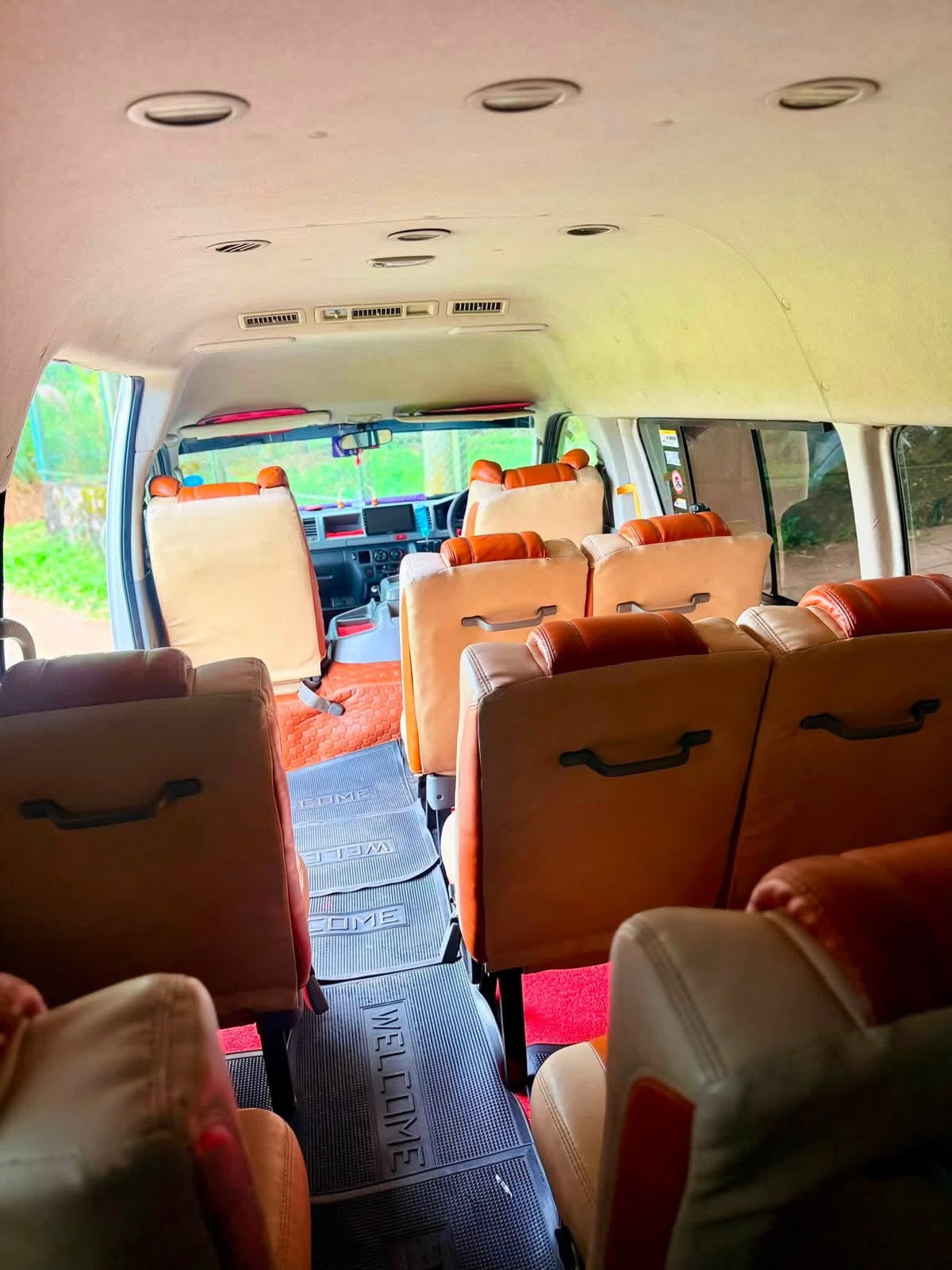 Central aisle and passenger seats inside a group van