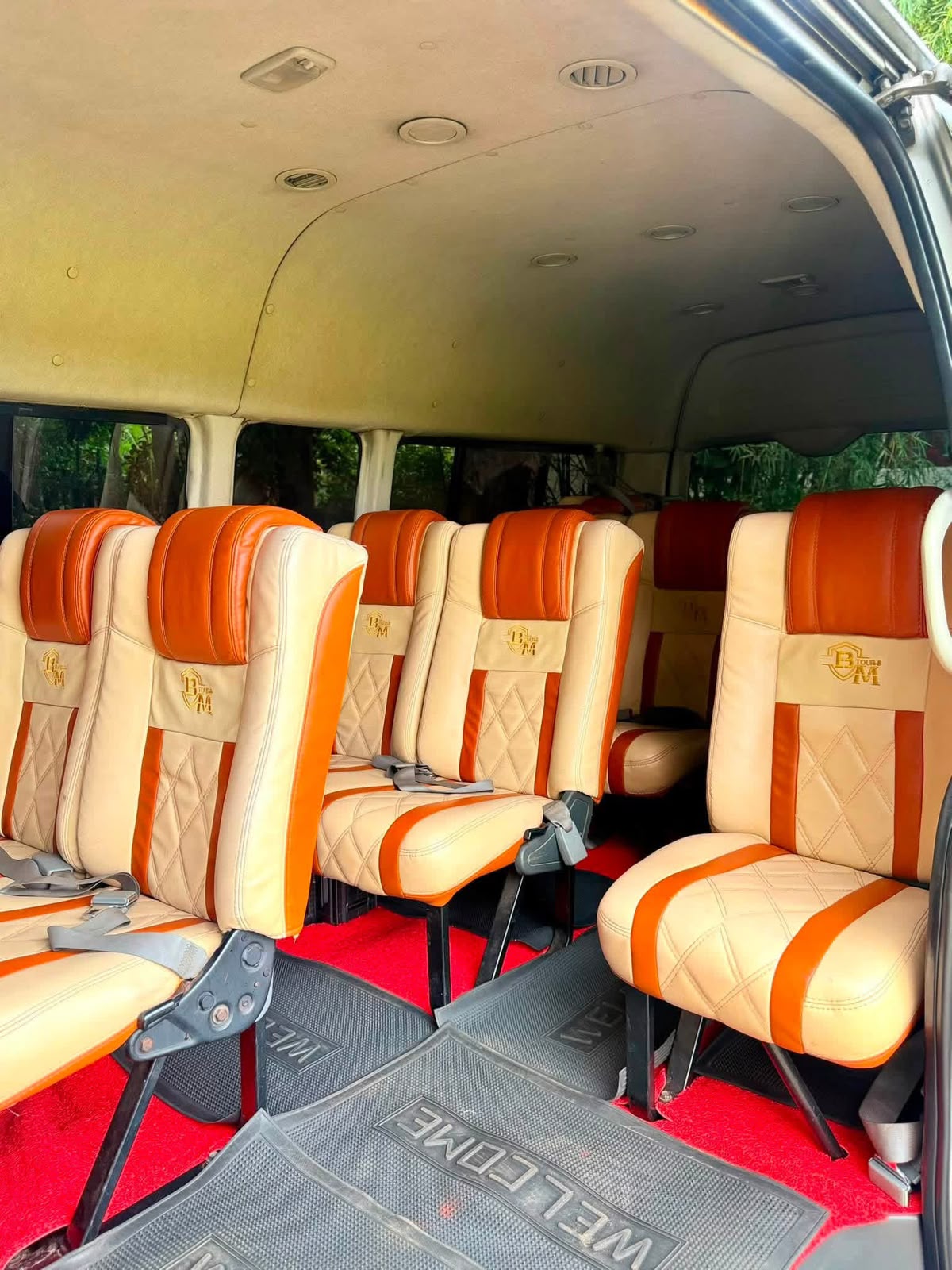 Rows of passenger seating inside a group van