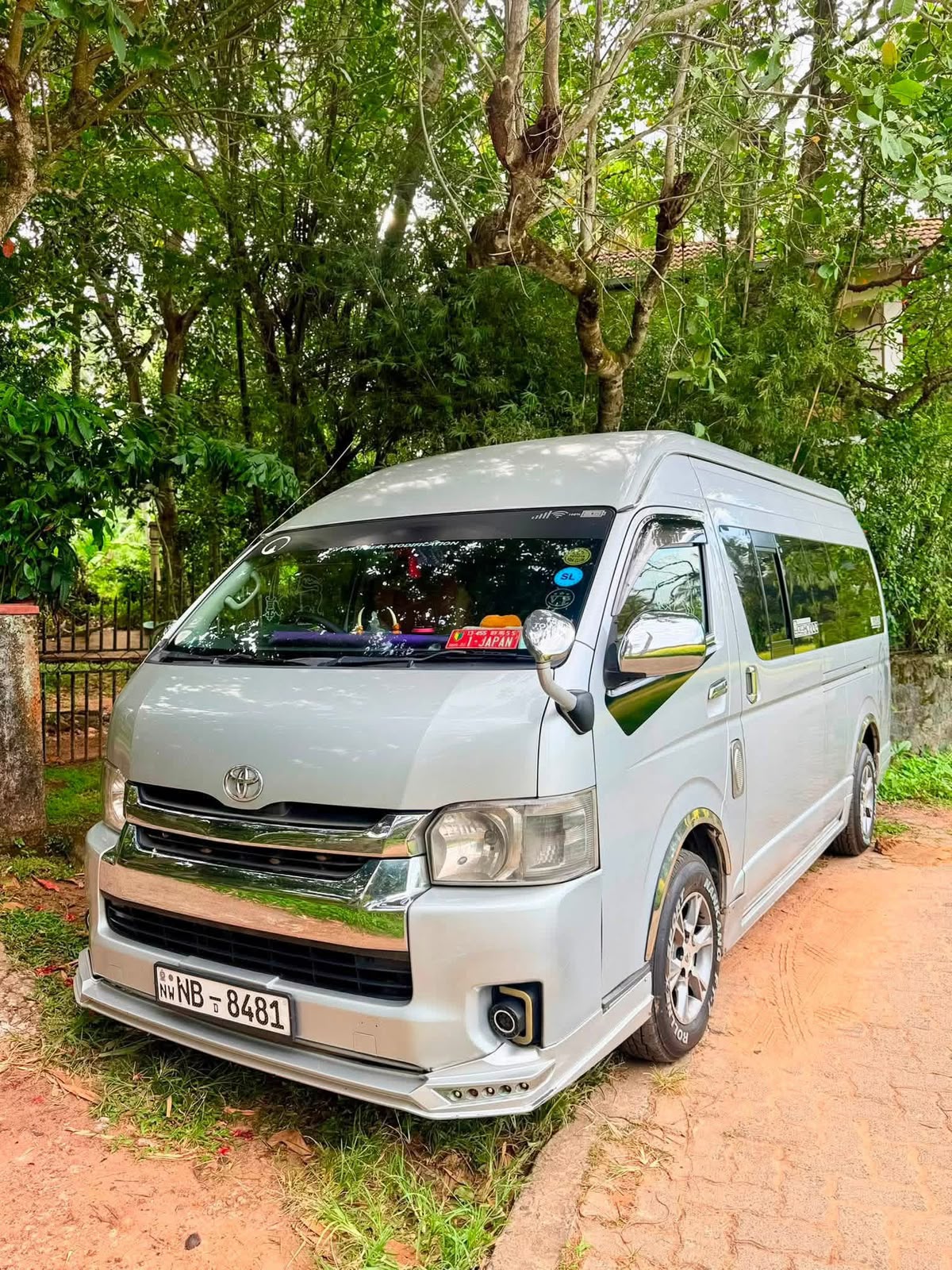 Silver passenger van viewed from the front